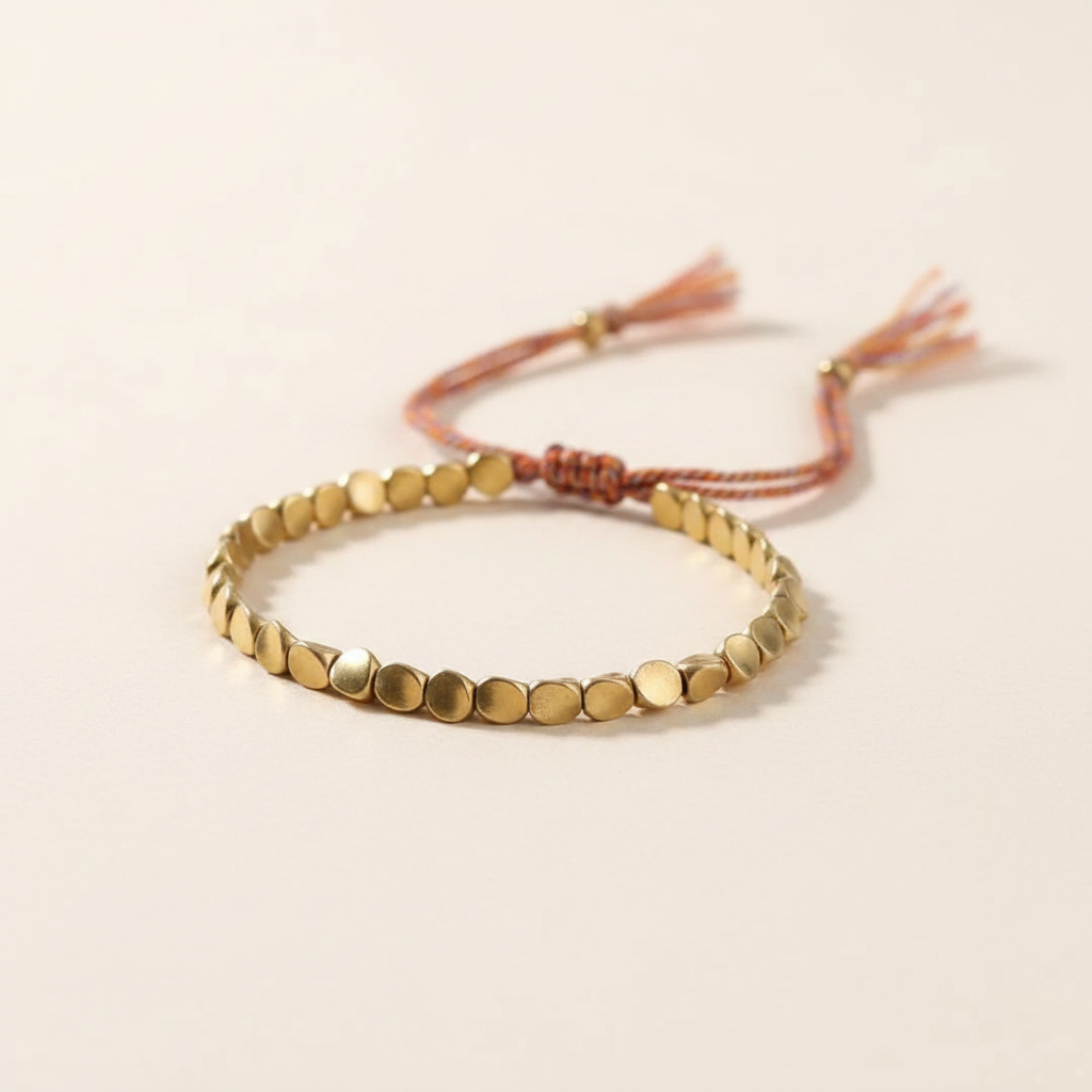 Pulsera cuentas doradas cordón multicolor