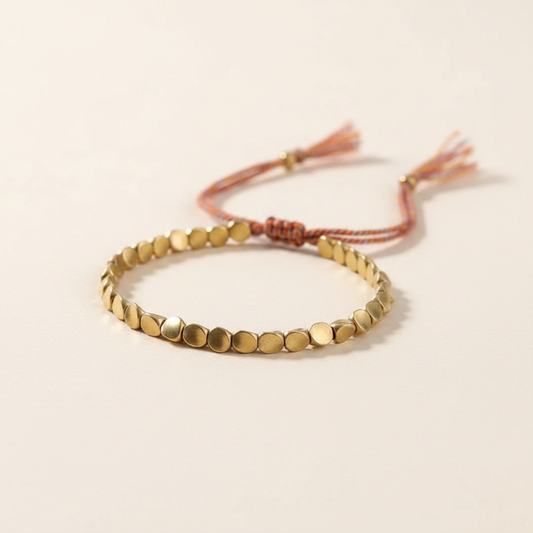 Pulsera cuentas doradas cordón multicolor
